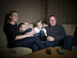 Family in front of the TV