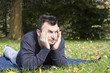 Foto: Young Adult Relaxing in the Park Young Adult Relaxing in the Park