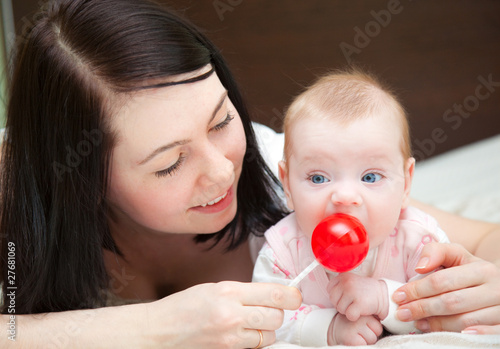 Photo: a smiling mother with her baby a smiling mother with her baby