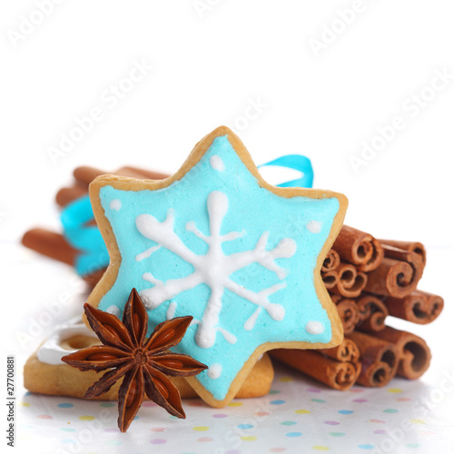 Photo: Christmas cookies with cinnamon and anise on white isolated back Christmas cookies with cinnamon and anise on white isolated back