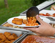 Serving of a plate of beans and nuggets Serving of a plate of beans and nuggets