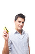 Handsome young man holding a credit card