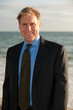 attractive business man on the beach