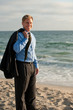 Attractive business man on the beach in suiet