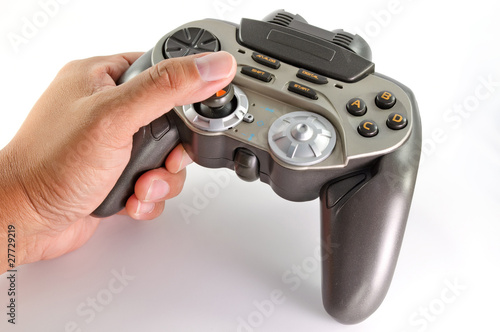 Foto: playing with joypad on white background . playing with joypad on white background .