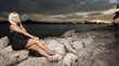 Woman sitting on the rocks Woman sitting on the rocks