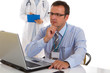 Male doctor with nurse in the background