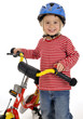 Kleines Mädchen mit Kinderrad und Helm