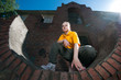 Teenage hip-hop girl on red brick wall