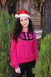 YOUNG LADY WITH SANTA CLAUS HAT