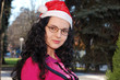 YOUNG LADY WITH SANTA CLAUS HAT
