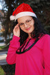 YOUNG LADY WITH SANTA CLAUS HAT