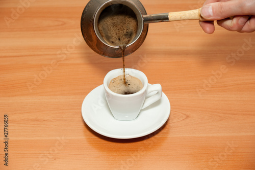 Photo: Coffee pour in a cup Coffee pour in a cup