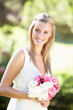 Bride Wearing Dress Holding Bouqet At Wedding Bride Wearing Dress Holding Bouqet At Wedding