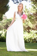 Bride Wearing Dress Holding Bouqet At Wedding Bride Wearing Dress Holding Bouqet At Wedding