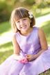 Portrait Of Bridesmaid Holding Bouquet Outdoors Portrait Of Bridesmaid Holding Bouquet Outdoors
