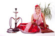 Retro bellydancer posing with hookah.