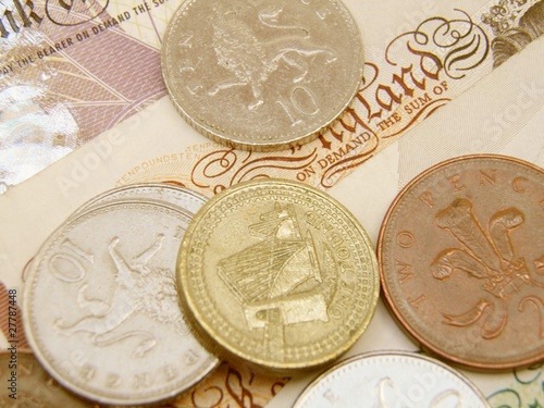 Photo: British Sterling pound currency banknotes and coins British Sterling pound currency banknotes and coins