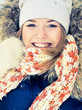 Happy young woman plays with a snow