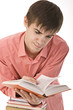 young boy reading a book
