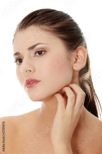 Photo: Young beautiful woman scraching her self Young beautiful woman scraching her self