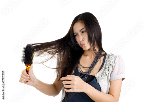 Photo: woman brushing her hair woman brushing her hair