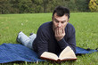 Photo: Young Adult Reading at the Park Young Adult Reading at the Park