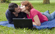 Photo: Young Adult Couple Relaxing in the Park Young Adult Couple Relaxing in the Park