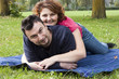Photo: Young Adult Couple Relaxing in the Park Young Adult Couple Relaxing in the Park