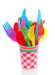 colorful plastic cutlery in a checkered red white cup isolated o colorful plastic cutlery in a checkered red white cup isolated o