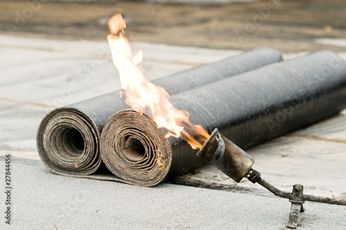 Photo: tar roofing felt roll and blowpipe with flame tar roofing felt roll and blowpipe with flame