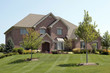 Luxury brick home with arched entry