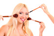 Beautiful young blonde woman with bright make-up and many brushe Beautiful young blonde woman with bright make-up and many brushe