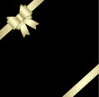 Golden gift ribbon and bow isolated on black Golden gift ribbon and bow isolated on black
