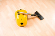 Vacuum cleaner on the polished wooden floor Vacuum cleaner on the polished wooden floor
