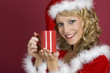 Sanata Claus Frau trinkt eine Milch.