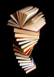 Pile of books on a black background Pile of books on a black background