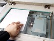 Person operating multi purpose machine Person operating multi purpose machine