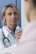 Doctor giving patient medicine
