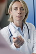Doctor giving patient medicine