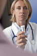 Doctor holding bottle of pills