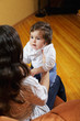 Baby girl looking at mommy