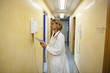 Doctor making telephone call in medical center