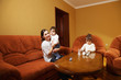 Smiling mother with daughters at home