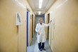 Doctor making telephone call in medical center