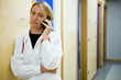 Doctor making telephone call in medical center
