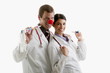 Male and female doctors with party toys