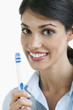 Young woman holding toothbrush