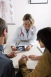 Doctor with ultrasound and couple