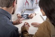 Doctor with ultrasound and couple